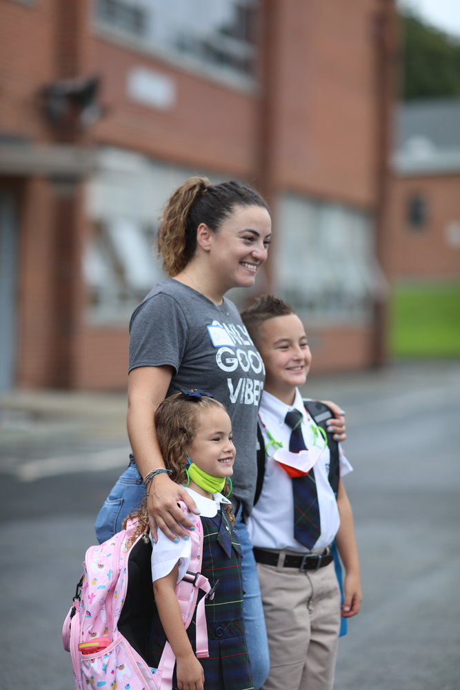 Rhode Island Catholic school students celebrate their first day back to class. Despite a few raindrops, students from St. Kevin School in Warwick were all smiles for their first day, September 1.